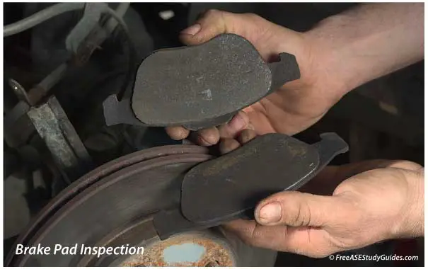 Check brake pad wear after removing the caliper.