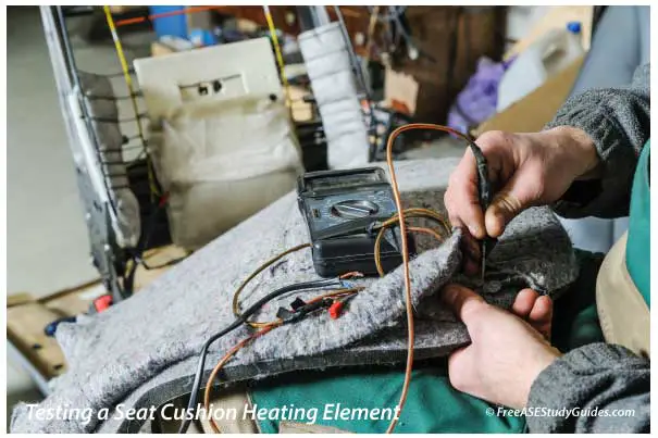 Testin a car seat heating element with a multimeter.